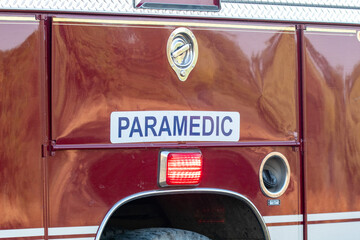 A paramedic sign on a red truck