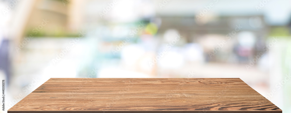 Aufkleber perspective wood table at lamp in restaurant blur background.coffee shop with bokeh light,mockup ban