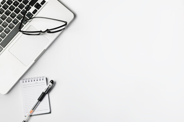 laptop with glasses and notebook