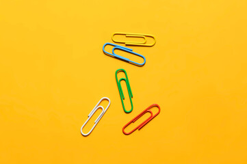 paper clips isolated on yellow background