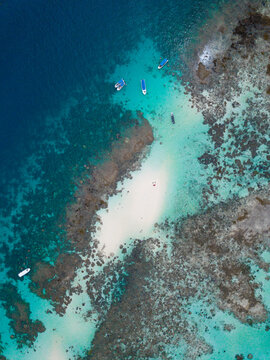 Ariel view over the celebes sea crystal clear sea and beach