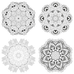 Hand drawn zentangle set of 4 mandalas for coloring page.