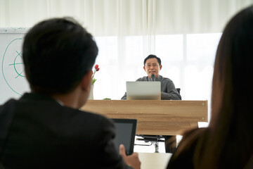 Asian lecturer explain how to business success planing with sales strategic in seminar class