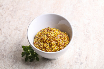 Grain mustard sauce in the bowl