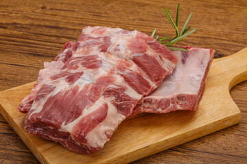 Raw pork ribs served rosemary
