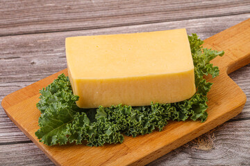 Tasty yelloow Tilsiter cheese brick