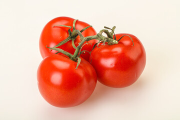Red bright ripe tomato branch