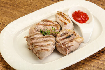 Grilled pork tenderlion with tomato sauce