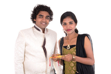 Indian brother and sister enjoying and celebrating Raksha Bandhan festival