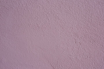 Beautiful purple textured stucco on the wall.