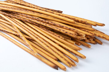 A bunch of breadsticks on a white background. Art bread, bread stick.
