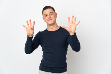 Young caucasian man isolated on white background counting nine with fingers