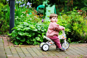 Baby girl on balance bike