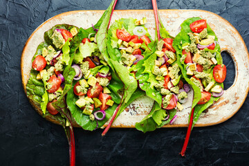 Spring vegetable salad in chard leaves