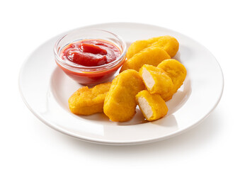 Chicken nuggets and ketchup on a plate placed on a white background.