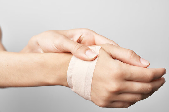 female injured arm bandage health problems