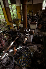 abandoned industrial area with pipes and taps