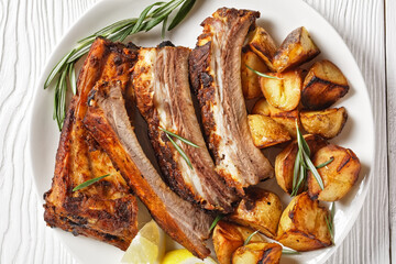 grilled pork ribs served with roast new potatoes