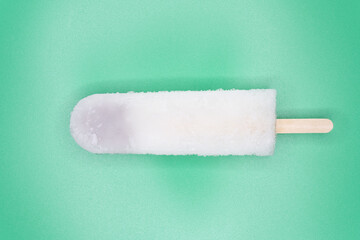 top view fresh red bean popsicle on a green background