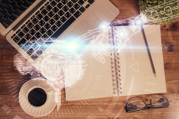 Double exposure of brain drawing hologram over topview work table background with computer. Concept of big data.