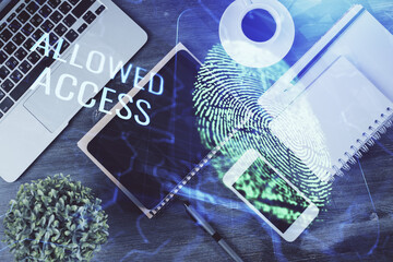 Double exposure of finger print over table with phone. Top view. Concept of mobile security.