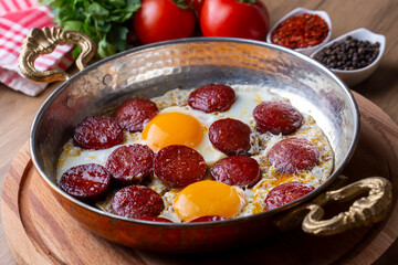 Turkish style fried egg with sausage