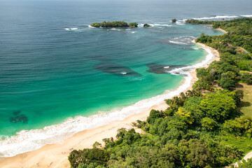 Tropical Island Aerial View. Wild coastline lush exotic green jungle. Red Frog Beach in Bastimentos...