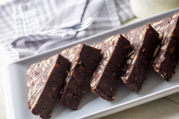 Delicious mosaic chocolate and biscuit cake served in a white plate (Turkish name; Mozaik pasta or Mozaik kek)