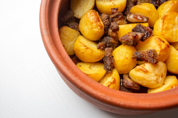 From traditional delicious Turkish food; potato and meat dish in casserole (Turkish name; Guvec tas kebabi, tandir)
