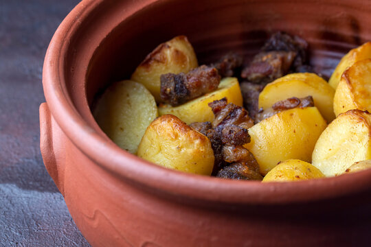 From traditional delicious Turkish food; potato and meat dish in casserole (Turkish name; Guvec tas kebabi, tandir)
