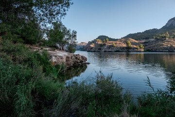 Fototapeta na wymiar The Tibi reservoir, in Alicante, Spain, at dawn.