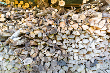 Close up to the pile of wooden logs required for winter season to heat the house with chimney or stove. 