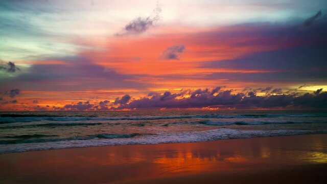 June 15, 2021. PHUKET THAILAND SEA BEACH. Dramatic sea sunset. Burning sky and shining golden waves. Amazing scene of Beautiful golden beach refection sunlight in sunset in the sea.  