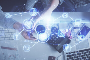 Double exposure of man and woman working together and social network theme hologram drawing. Computer background. connecting concept. Top View.