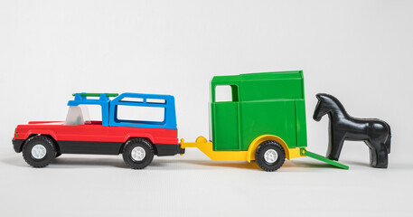 Fototapeta premium Plastic toy multicolored cars isolated on white background.