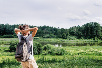 Bearded man looking at landscape. Young man enjoy the nature