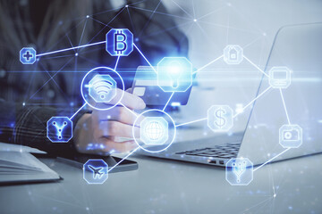 Multi exposure of woman on-line shopping holding a credit card and social network theme drawing. Relationship E-commerce concept.