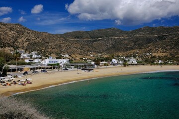 View of the amazing sandy and turquoise beach of Mylopotas on the island of Ios in Greece