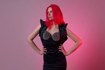 Goth sexy look. young attractive woman with pink hair