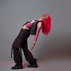 Futuristic fashion, a young bright and attractive woman with pink hair,