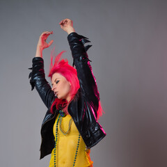 Futuristic fashion, a young bright and attractive woman with pink hair,