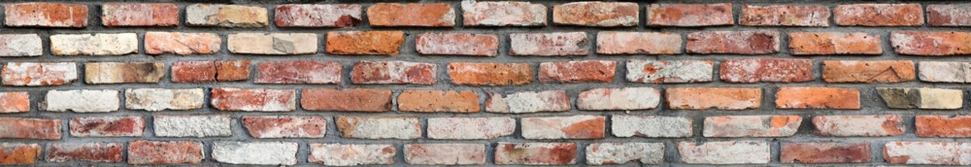 Wide old colorful panoramic brick wall