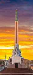 Obraz premium Monument of freedom in the capital of Latvia Riga city. Woman holding three gold stars symbolizing three major regions of Latvia