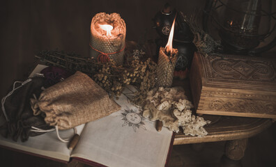 Magical attribute on a table, witchcraft concept, Candle fire, Spells and other rituals