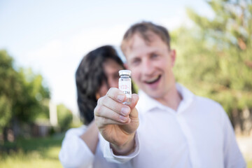 Covid-19 Corona Virus 2019-ncov vaccine. Couple love. Couple. Hope. Nature background. Smile....