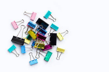 Colorful office paper clips on white background.