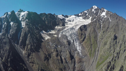Fototapeta na wymiar Caucasus, Ossetia. Tsey gorge. The upper part of the Skazka glacier. 