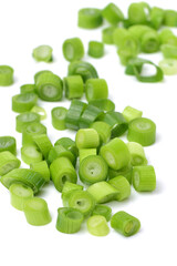 chopped green onions on white background