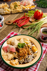 Mie rebus medan or Noodle Soup 

The dish is made of yellow egg noodles, which are also used in Hokkien mee, with a spicy slightly sweet curry-like gravy. The gravy is made from shrimp or tauchu broth