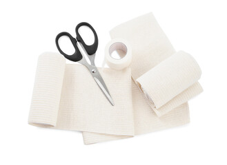 Medical bandage rolls, sticking plaster and scissors on white background, above view